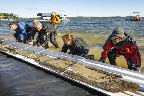Researchers work to safely extract 3,000 year old dugout canoe from Lake Mendota 
