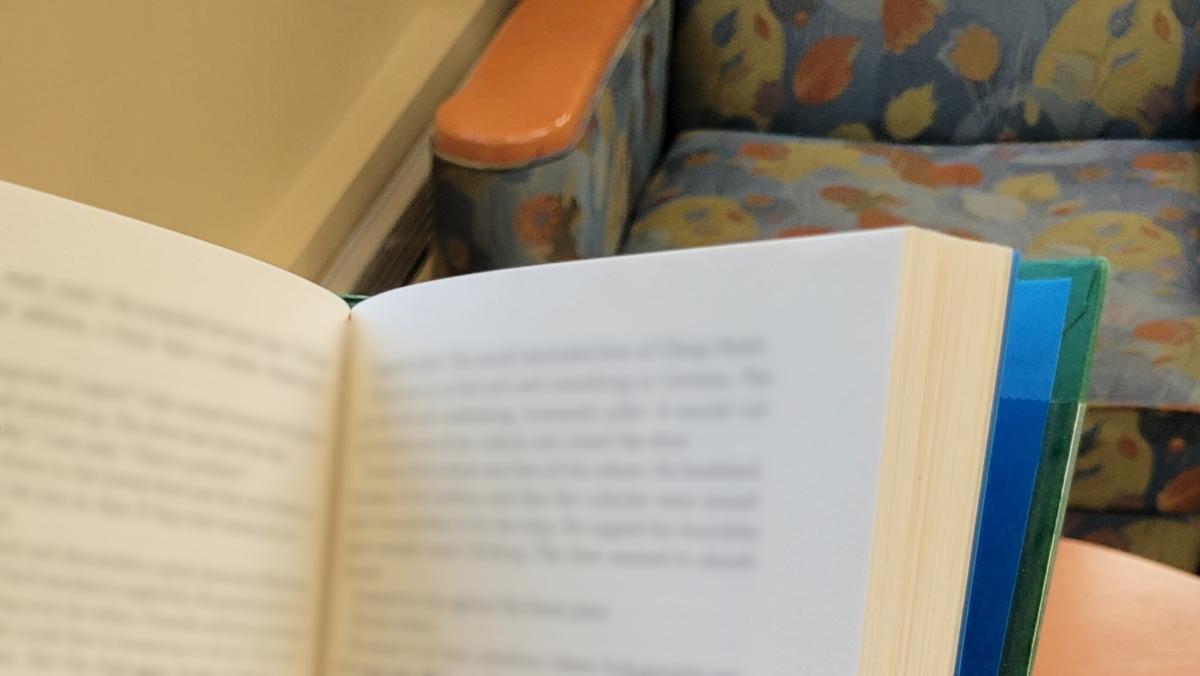 Patron reading in the library (close up)